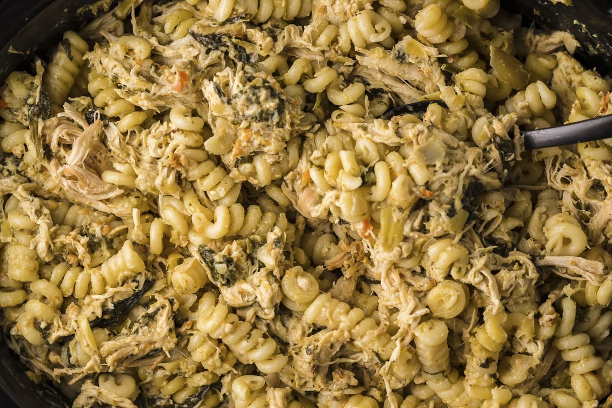 close up of pasta and chicken in slow cooker