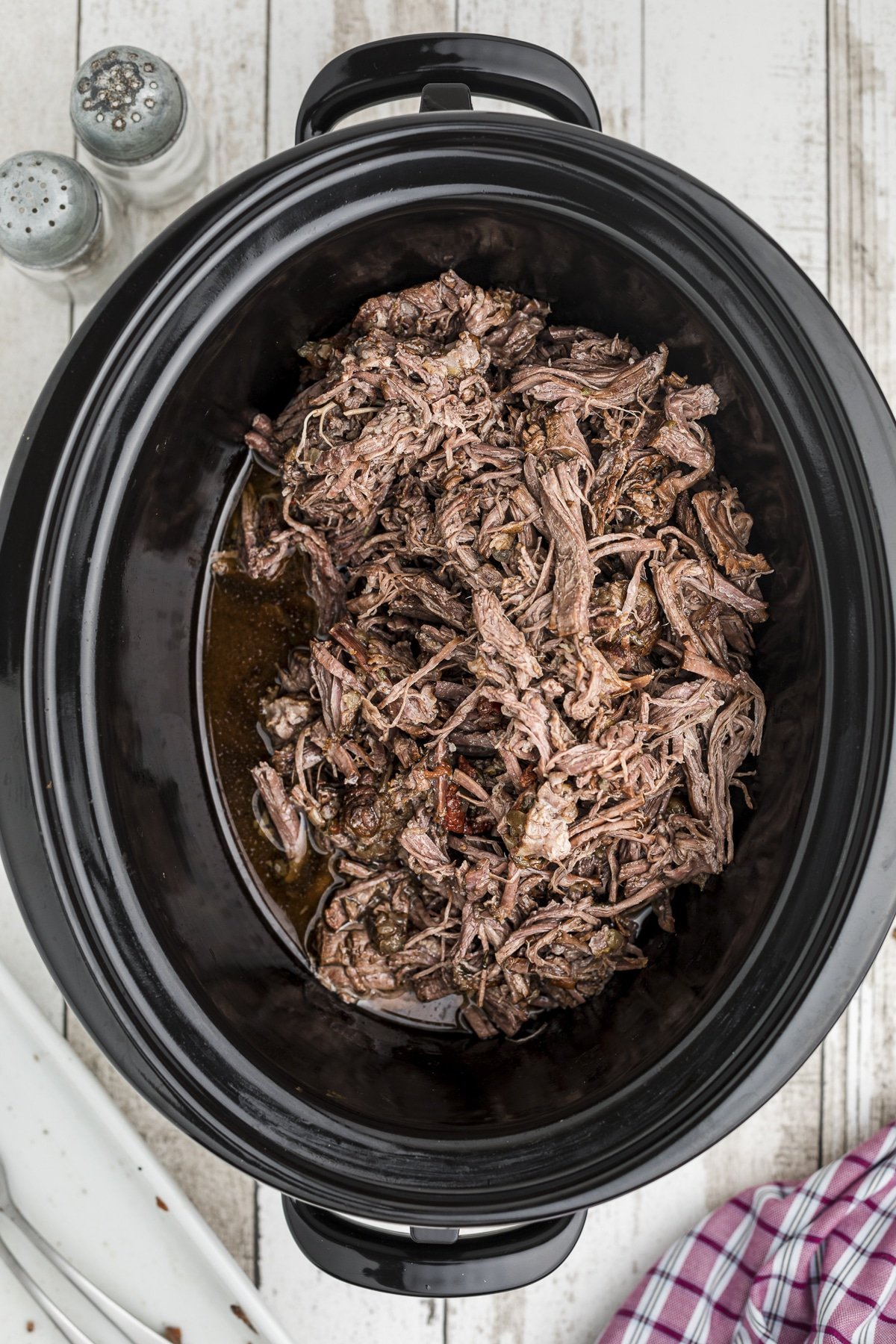the mexican shreded beef back in the crockpot.