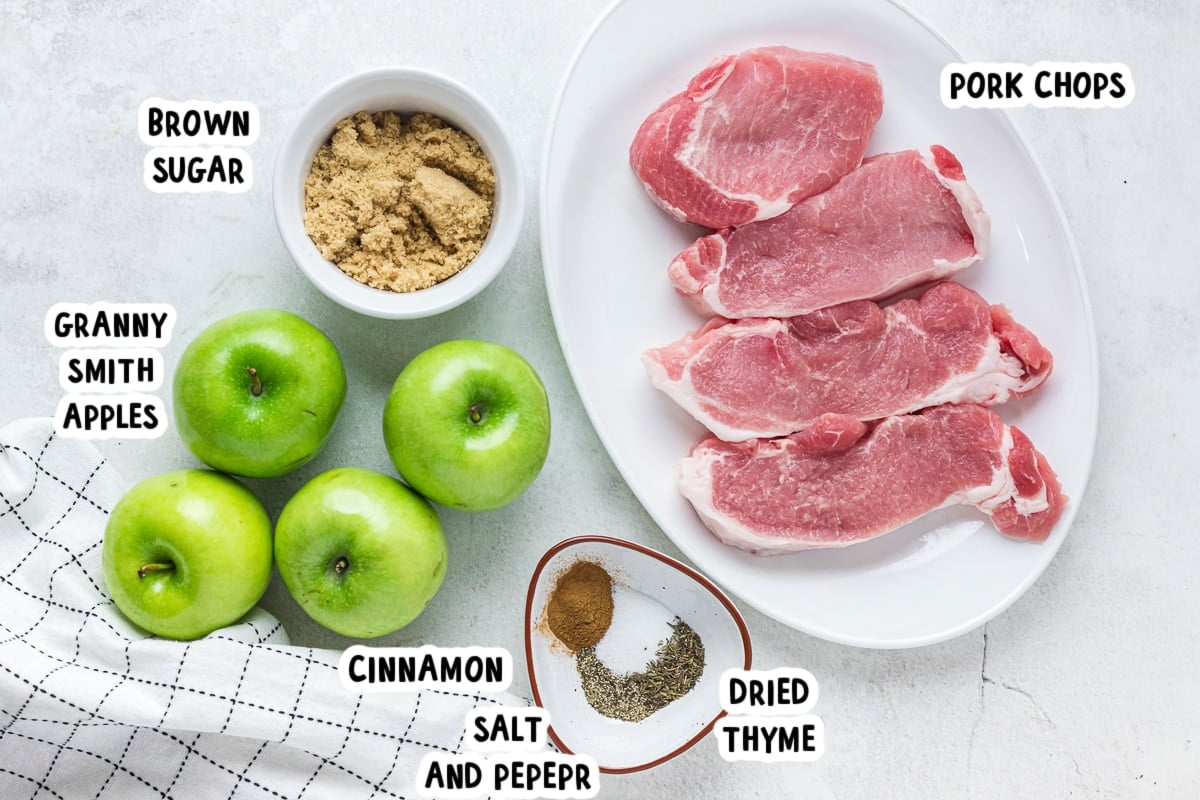 ingredients for pork chops and apples on a table