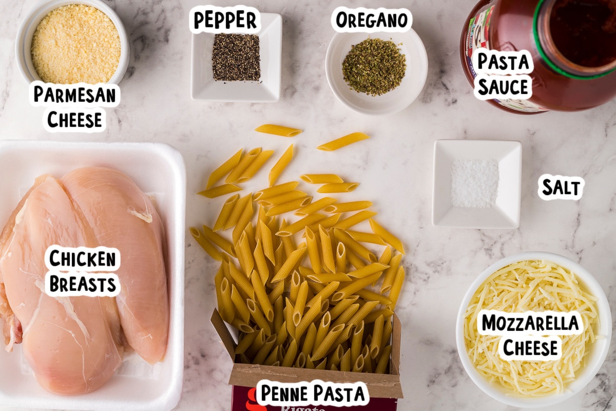ingredients for chicken parmesan on table with text overlay