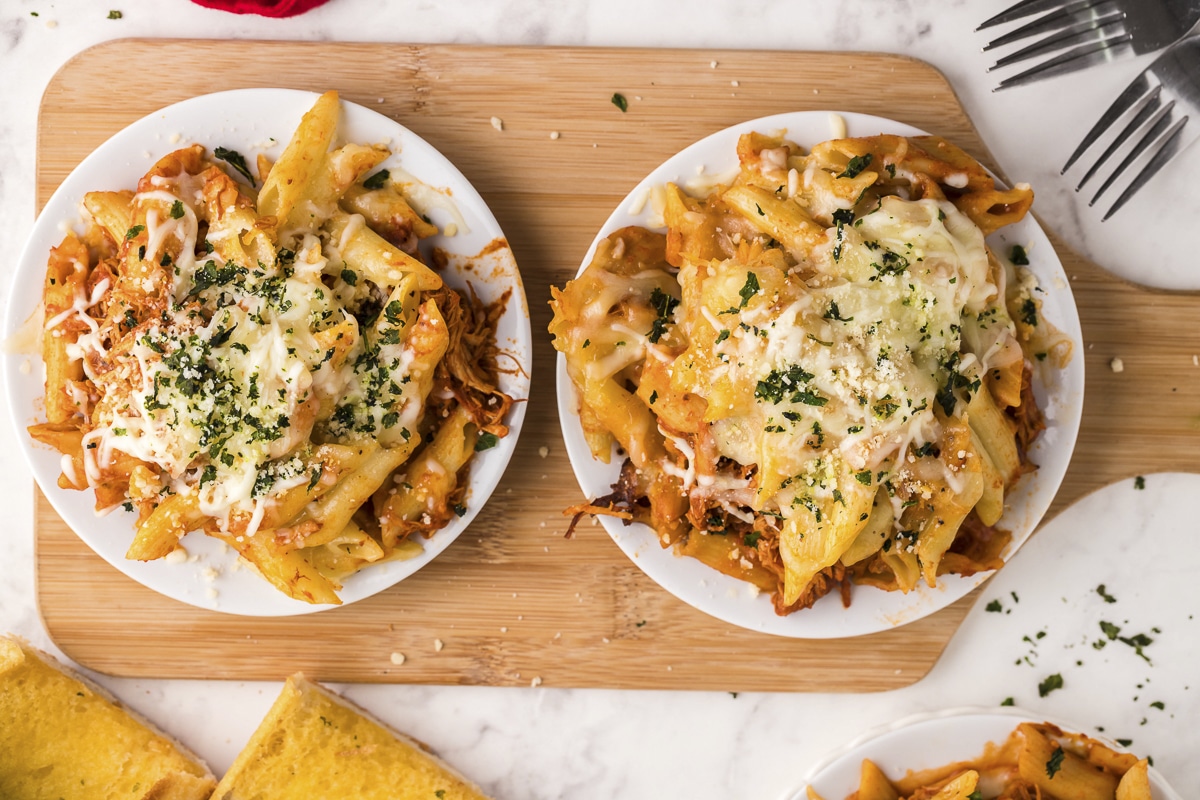 plates of chicken and pasta