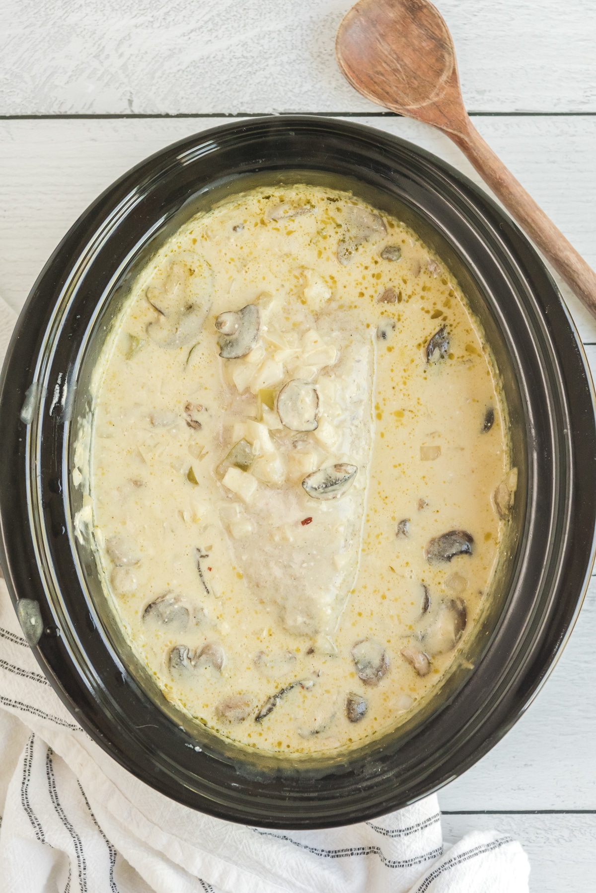 pork loin in creamy green chile sauce in slow cooker