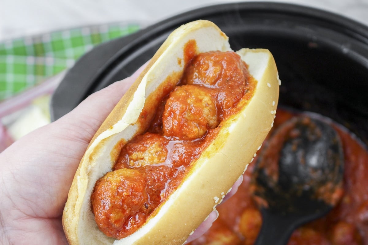 hand holding a meatball subs.