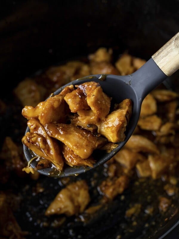 orange chicken on a spoon