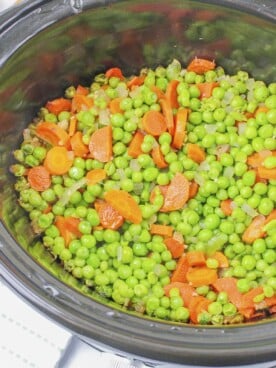 peas and carrots in buttery sauce in slow cooker