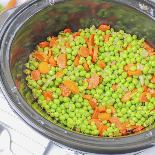 peas and carrots in buttery sauce in slow cooker