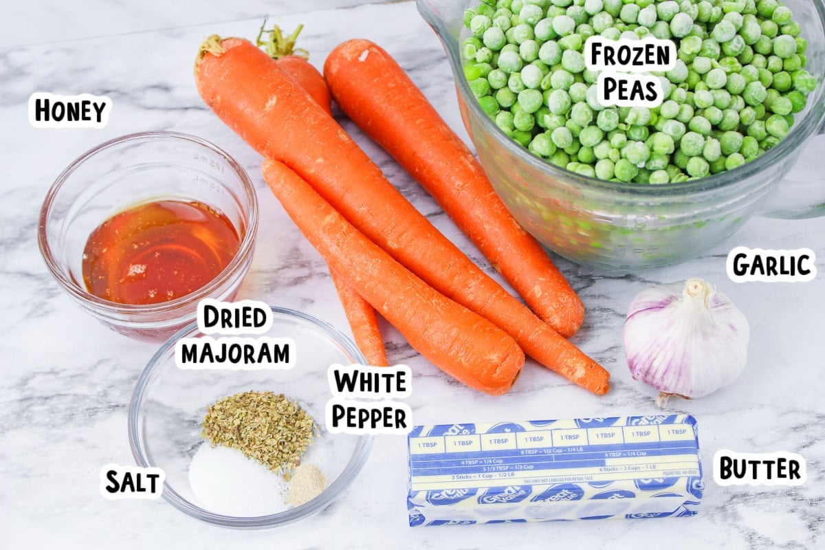 ingredients for peas and carrots on table
