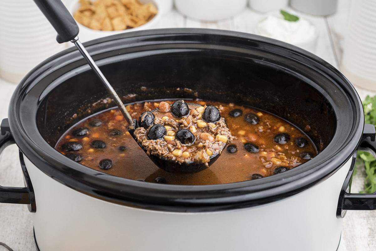 ladle of taco soup coming from slow cooker