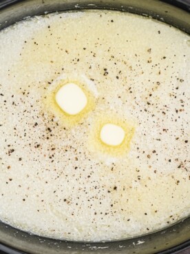 close up of grits with butter and black pepper