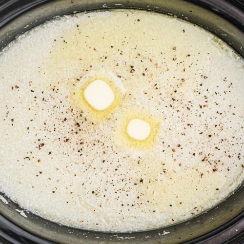 close up of grits with butter and black pepper