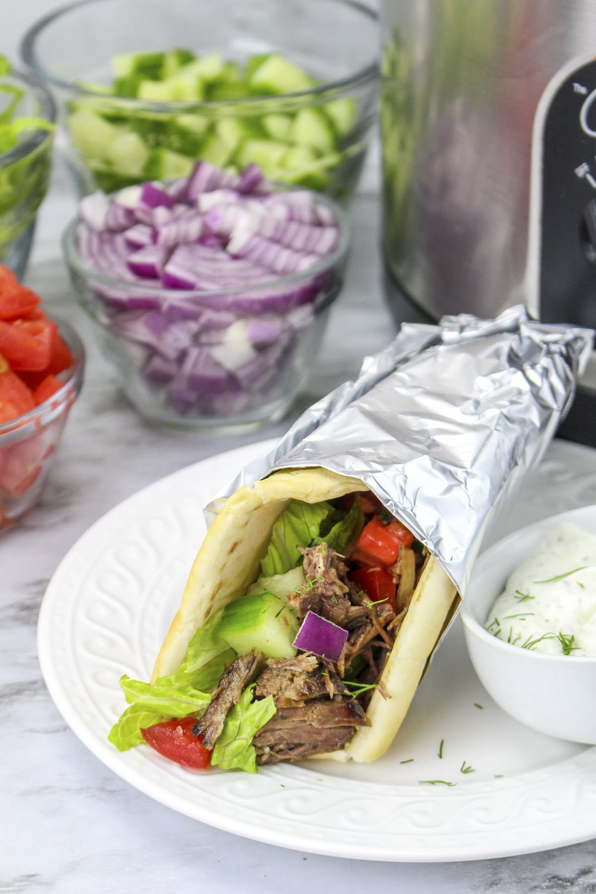 beef gyro in front of slow cooker.