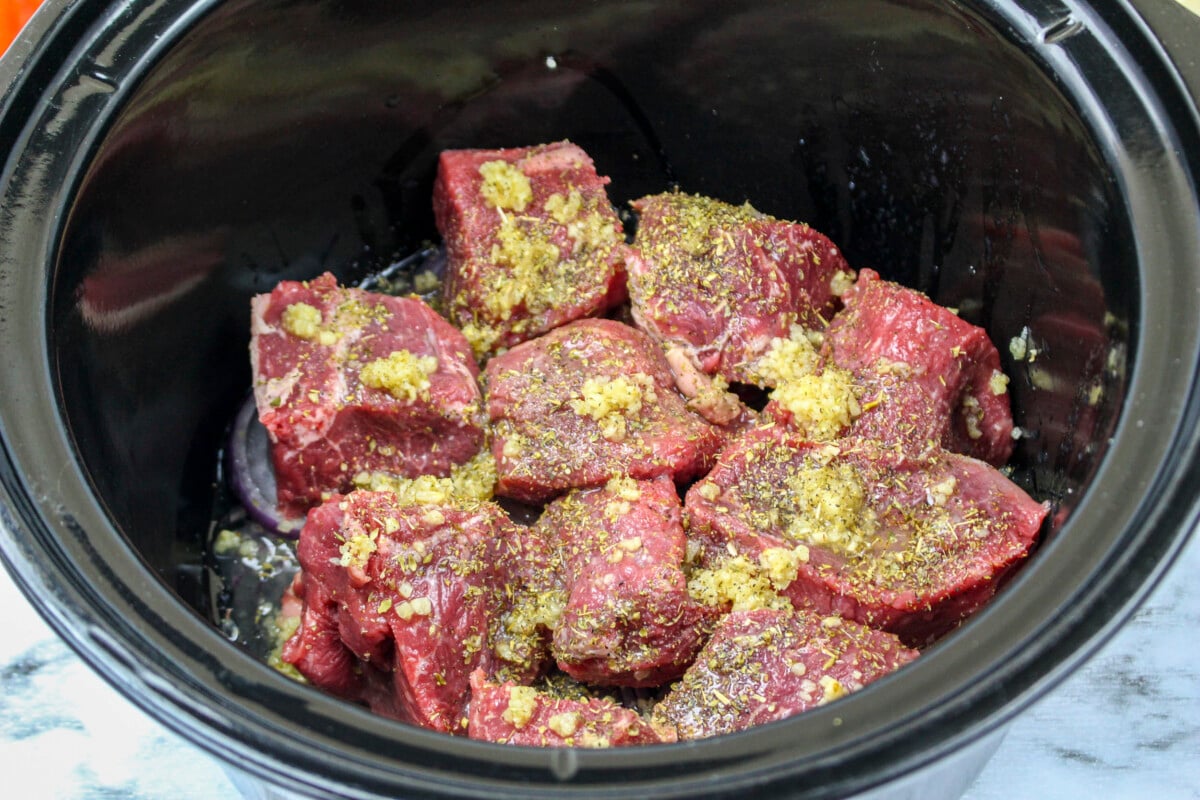 seasonings on top of the chuck roast.