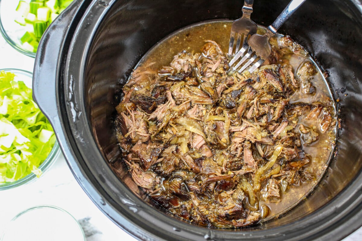 shredded beef gyro meat in slow cooker.