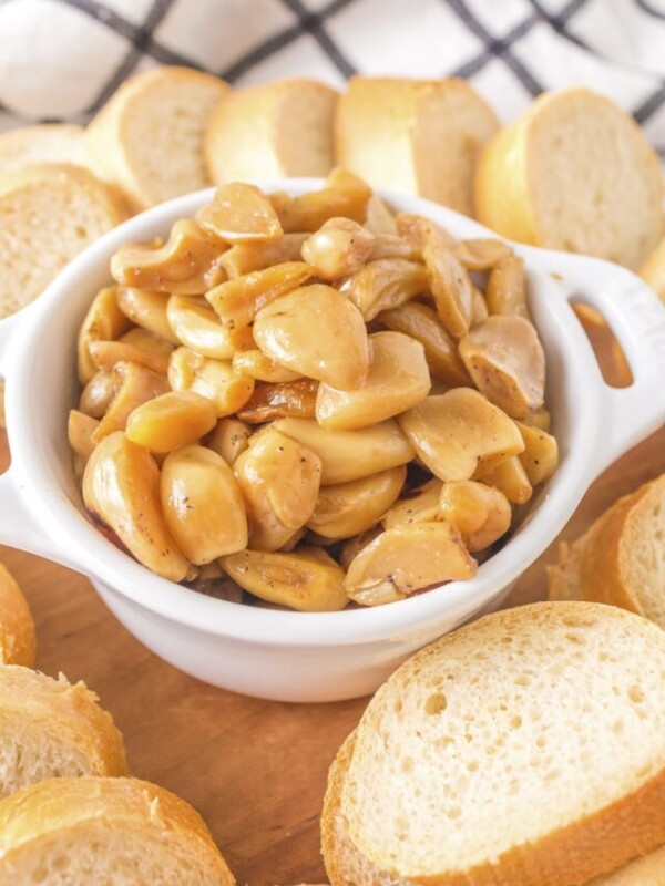 Cooked garlic confit in bowl.