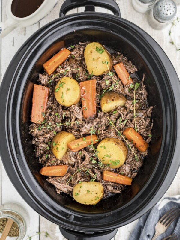 cooked venison pot roast in slow cooker.