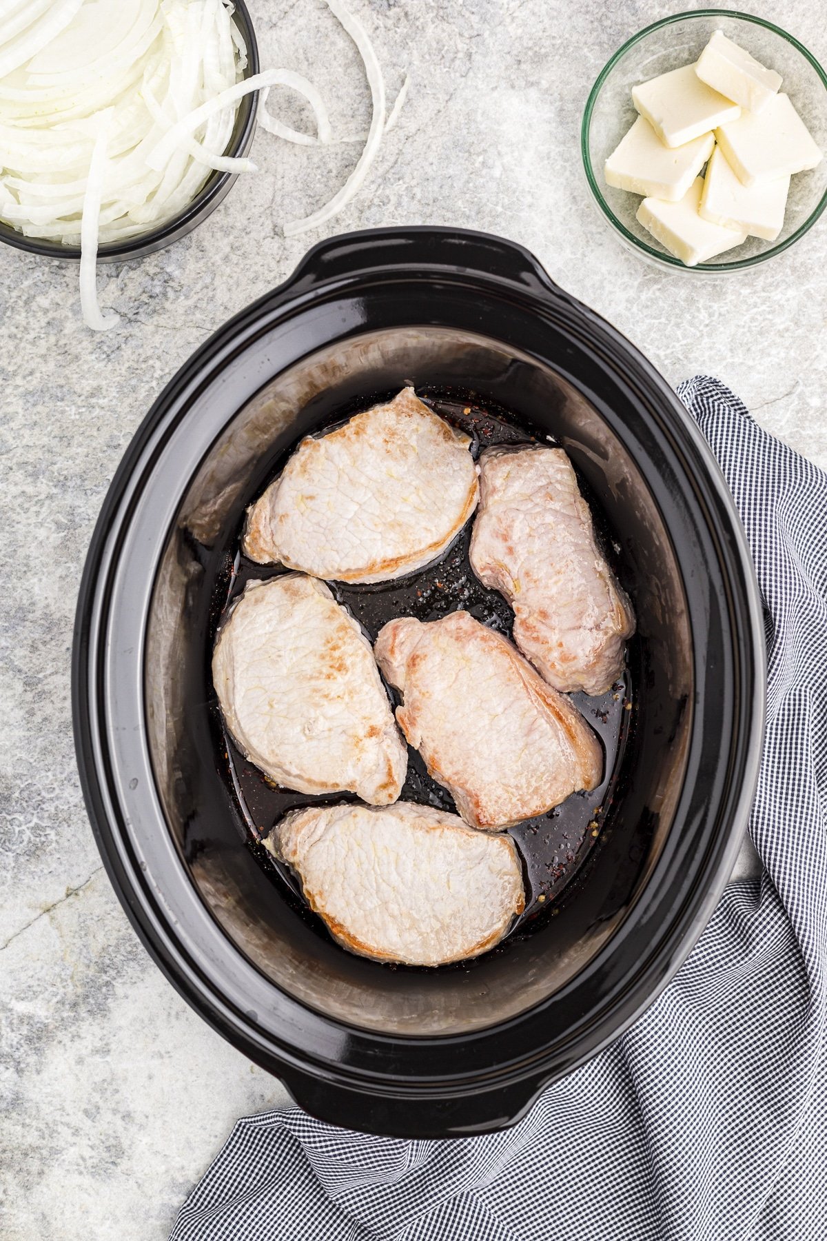 pork chops in a slow cooker with brown sugar and more.