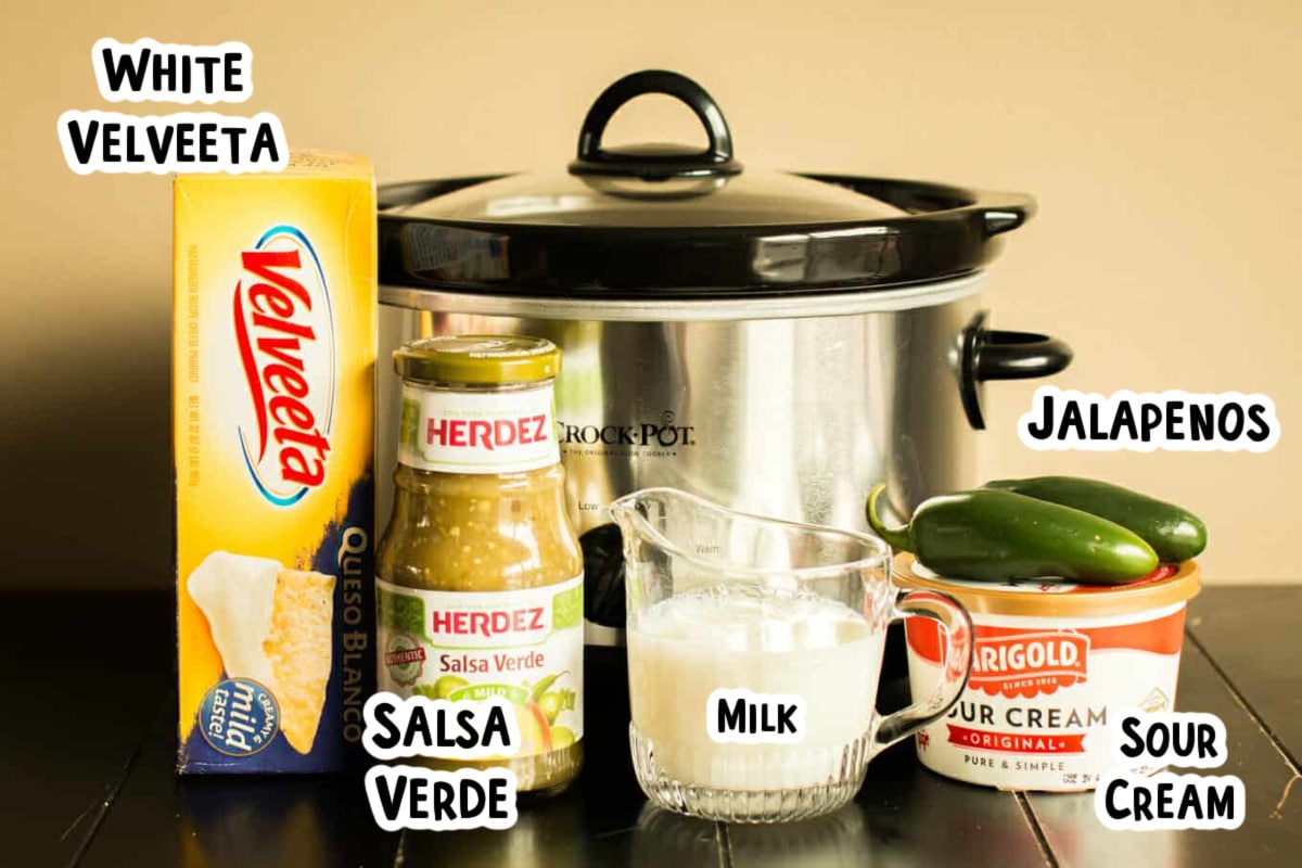 ingredients for queso verde in front of slow cooker.