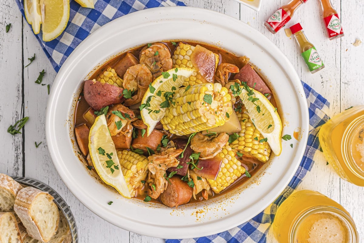 shrimp boil in crockpot with corn, potatoes and andouille sausage.