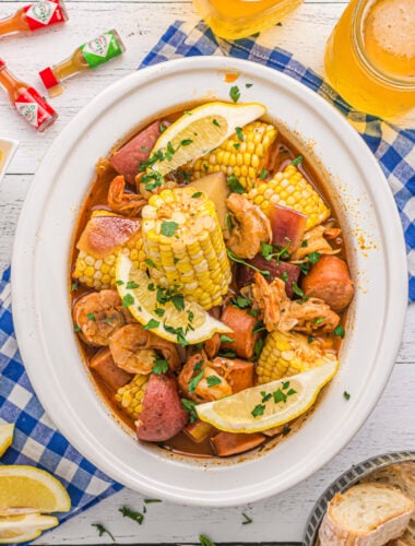 overhead shot of shrimp boil with corn and potatoes in slow cooker.