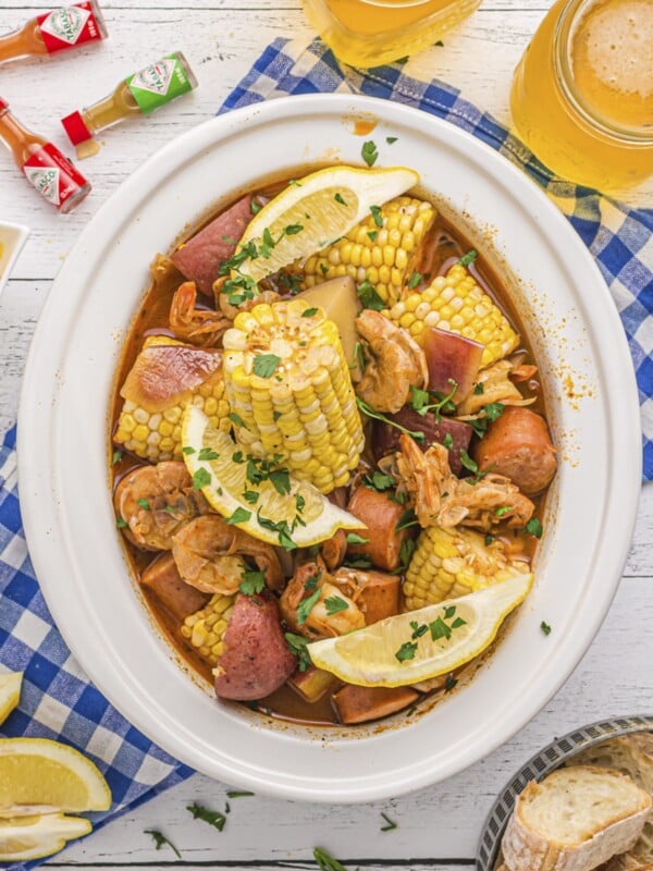 overhead shot of shrimp boil with corn and potatoes in slow cooker.