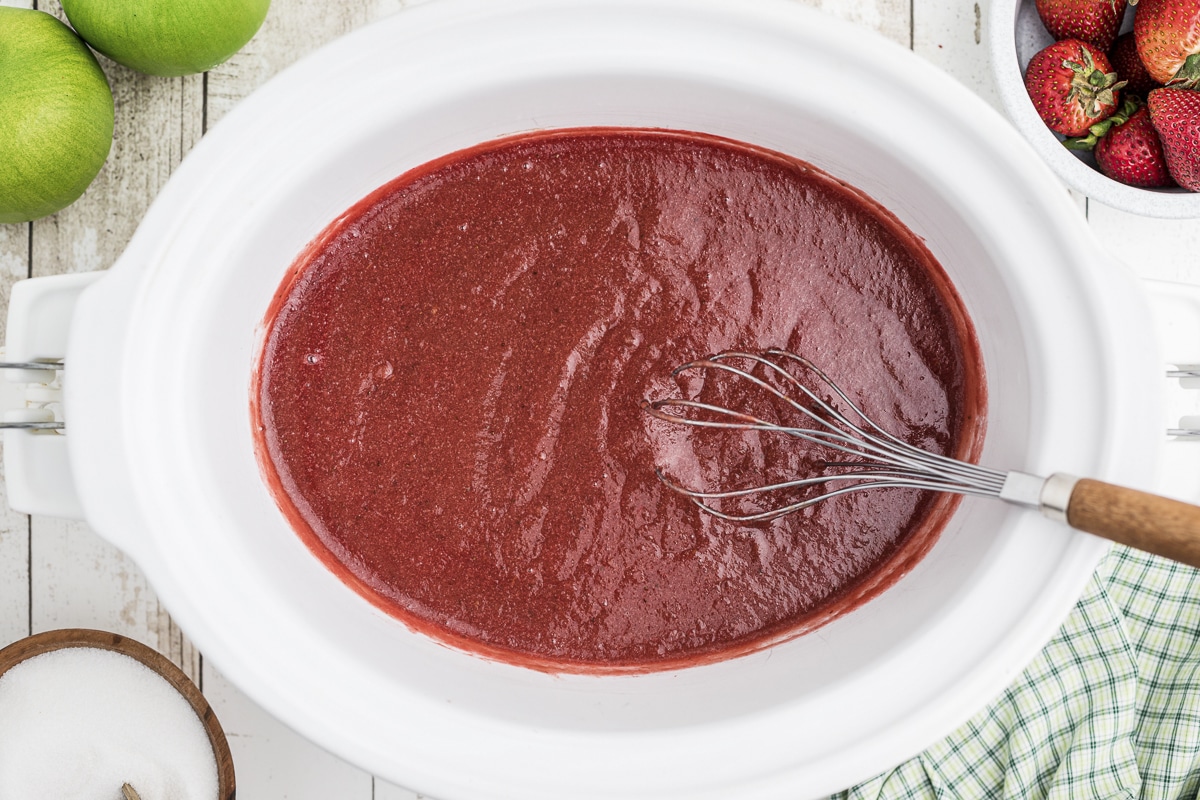 strawberry applesauce with whisk in it