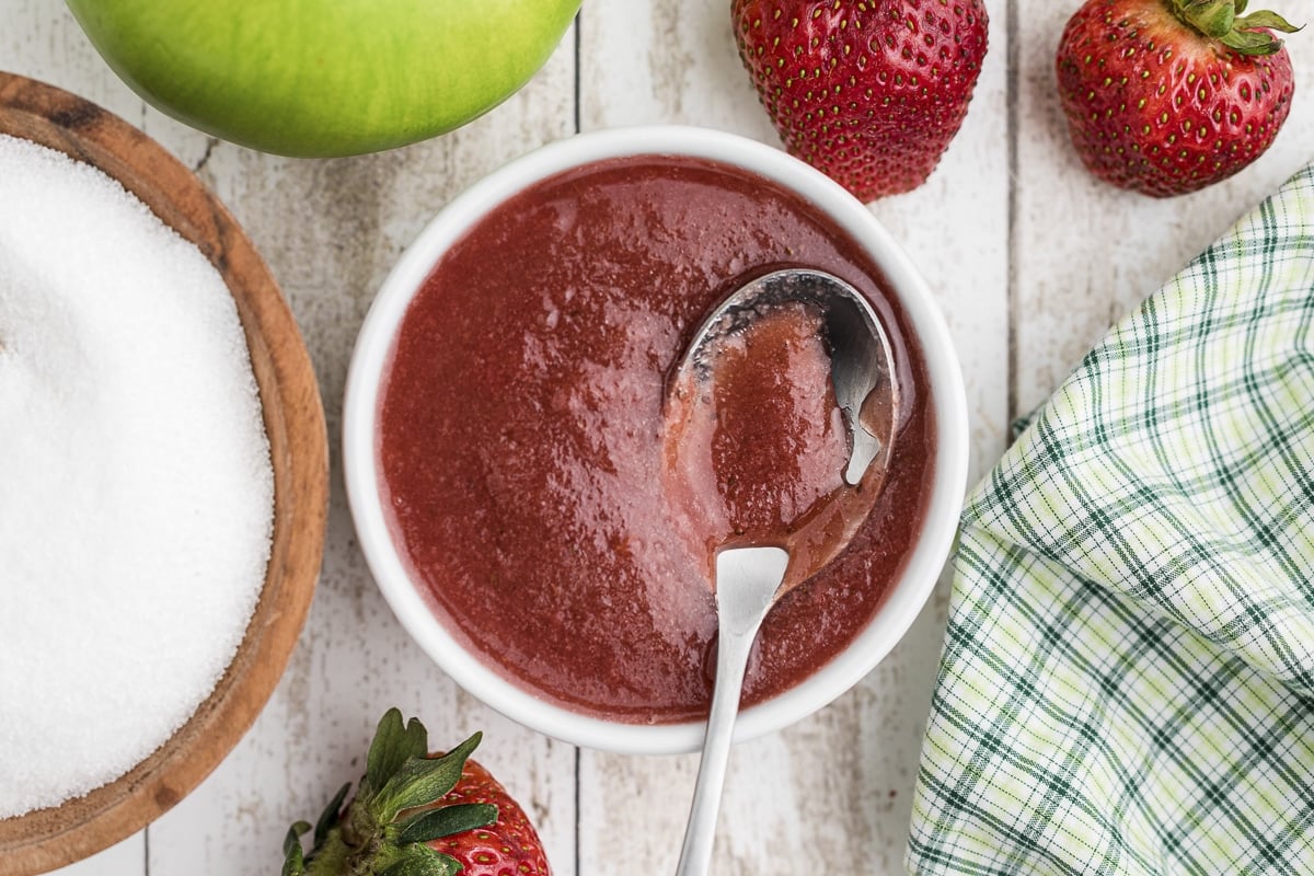 white bowl with strawberry apple sauce.