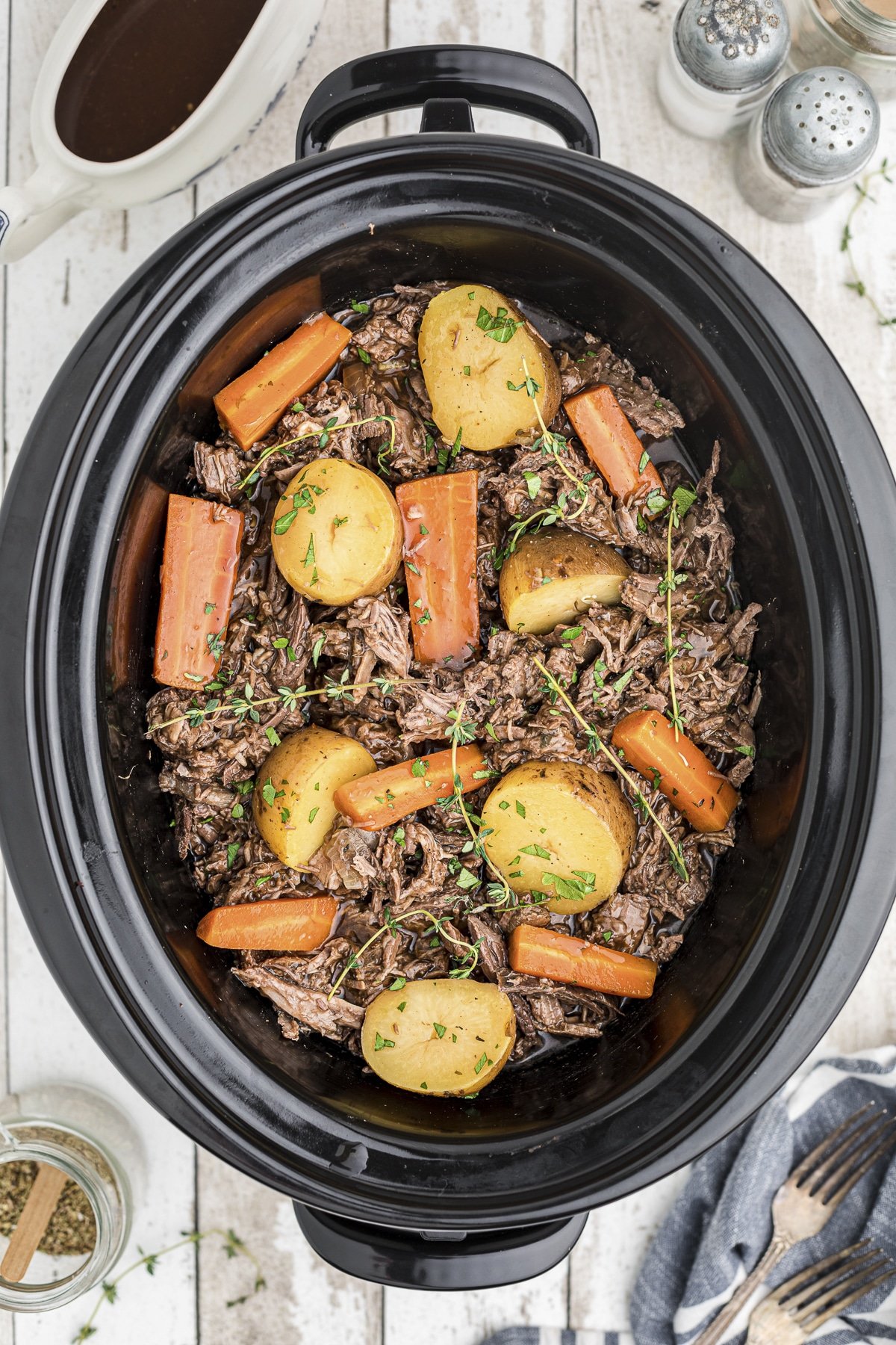 shredded venison roast and veggies in slow cooker.