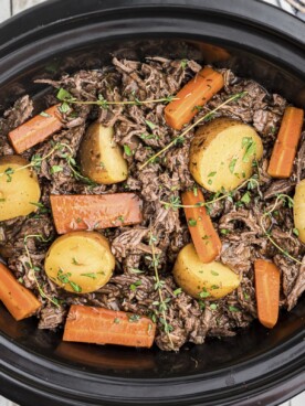 venison pot roast shredded with vegetables in crockpot