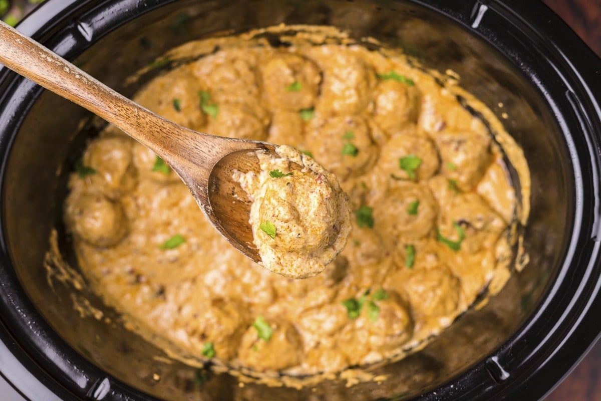 chipotle meatball on a wooden spoon.