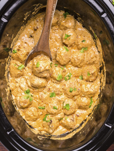 Chiptole meatballs done cooking in the slow cooker.