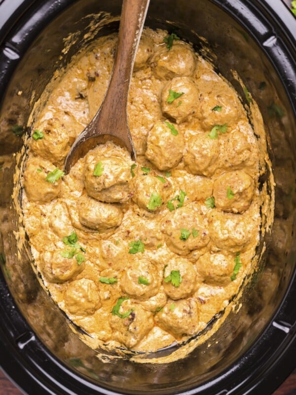 Chiptole meatballs done cooking in the slow cooker.