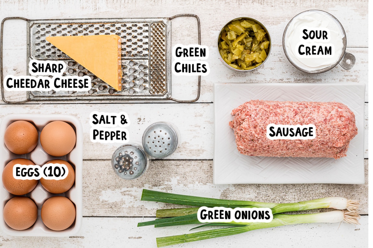 Ingredients for green chile sausage egg bake on table with text labels.