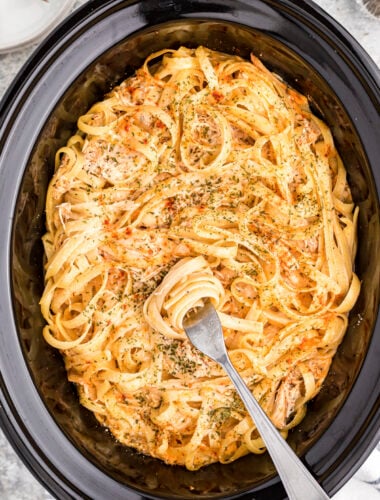 Close up of cajun chicken fettuccine in slow cooker.