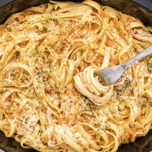 Fork in cajun chicken fettuccine in slow cooker.