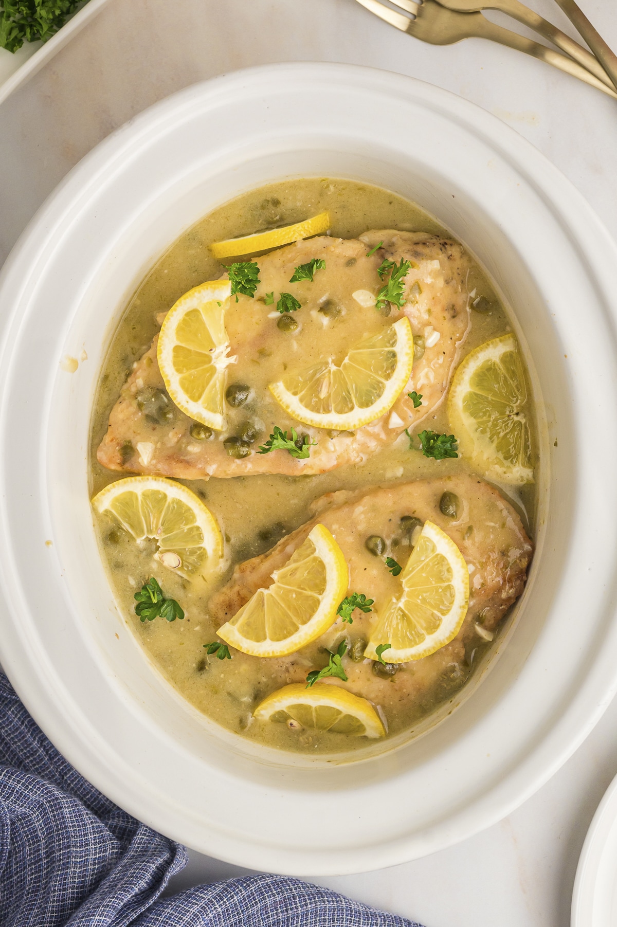Close up of chicken piccata in the slow cooker.