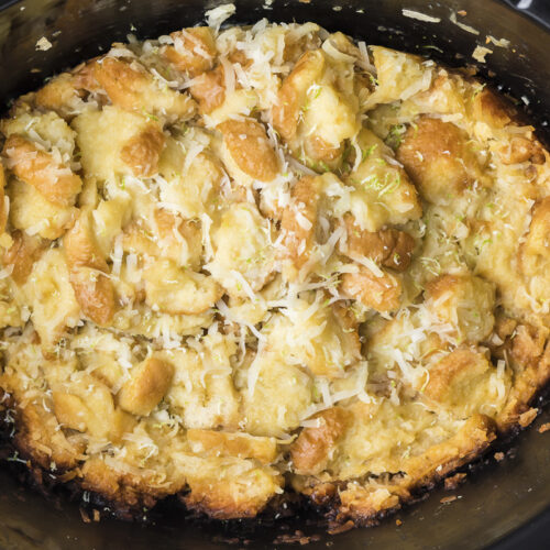 close up of coconut bread pudding in slow cooker.