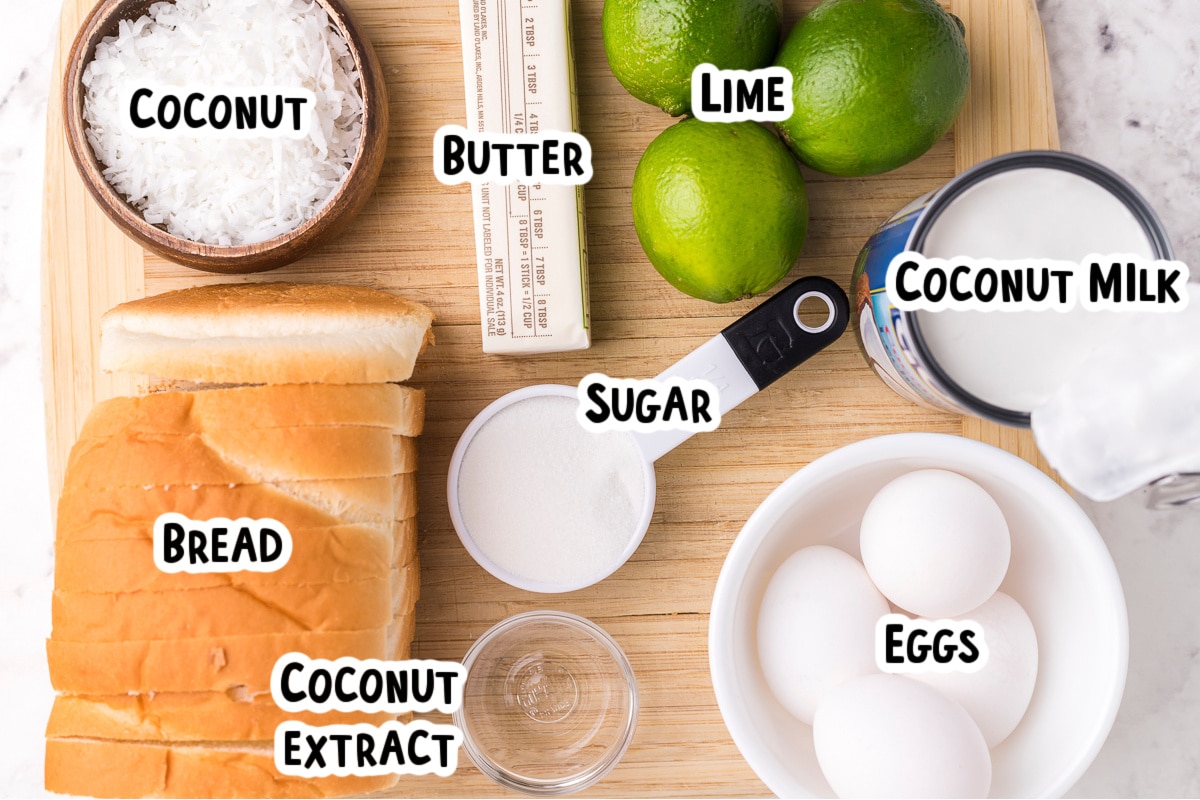 Ingredients for coconut bread pudding on table.