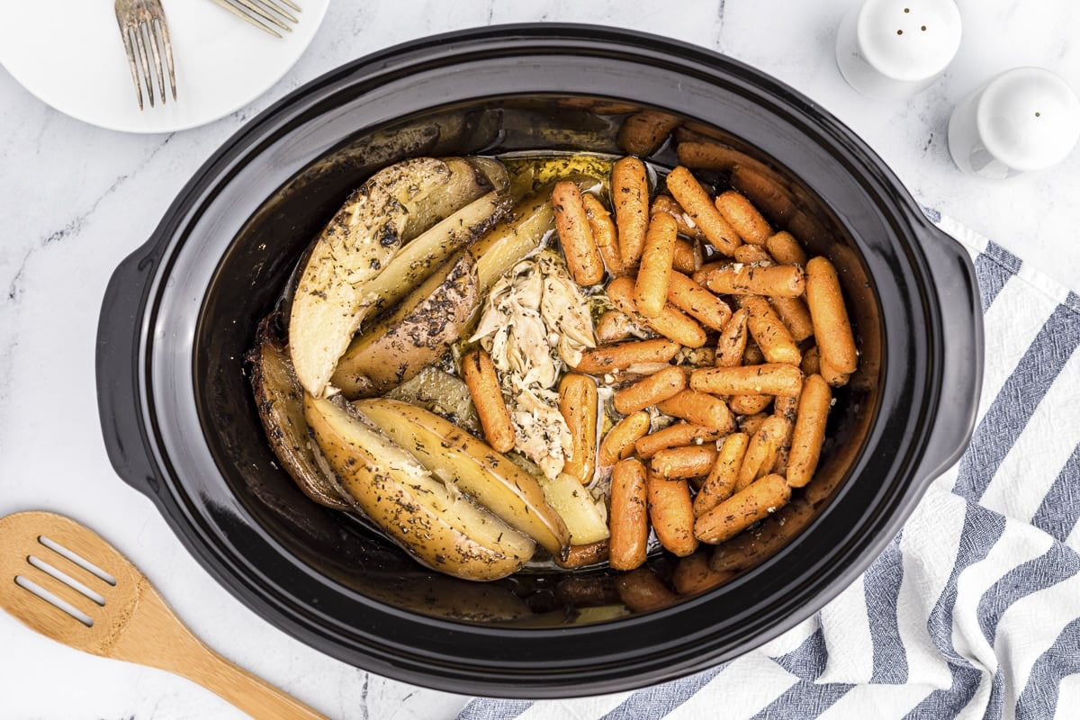 cooked garlic butter chicken in slow cooker.