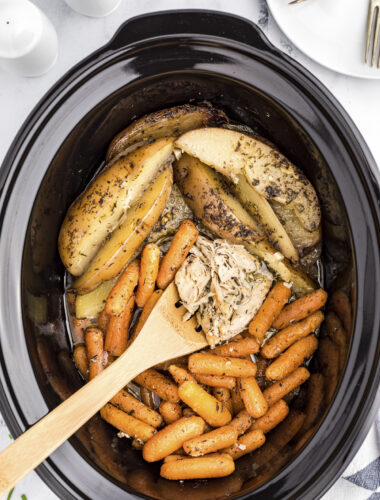 chicken with potatoes and carrots in crockpot.