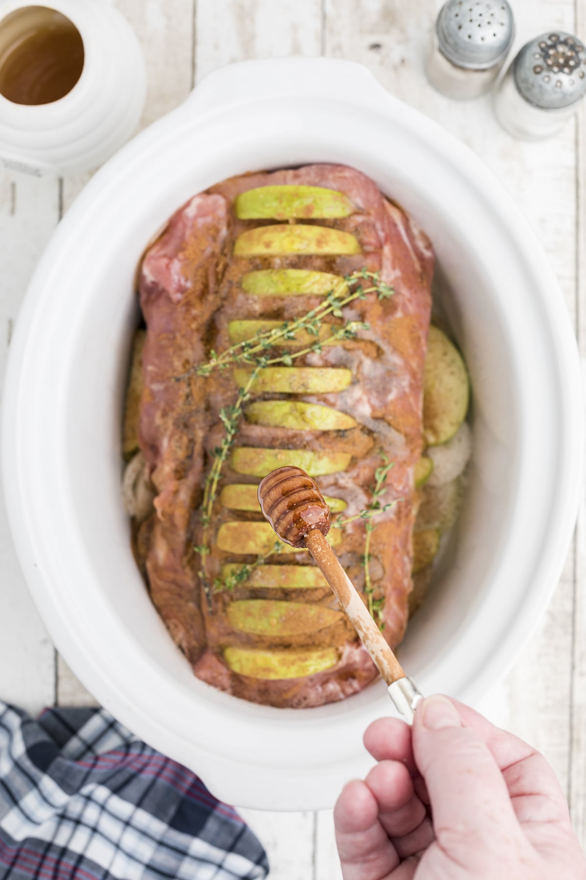honey being drizzled over the pork