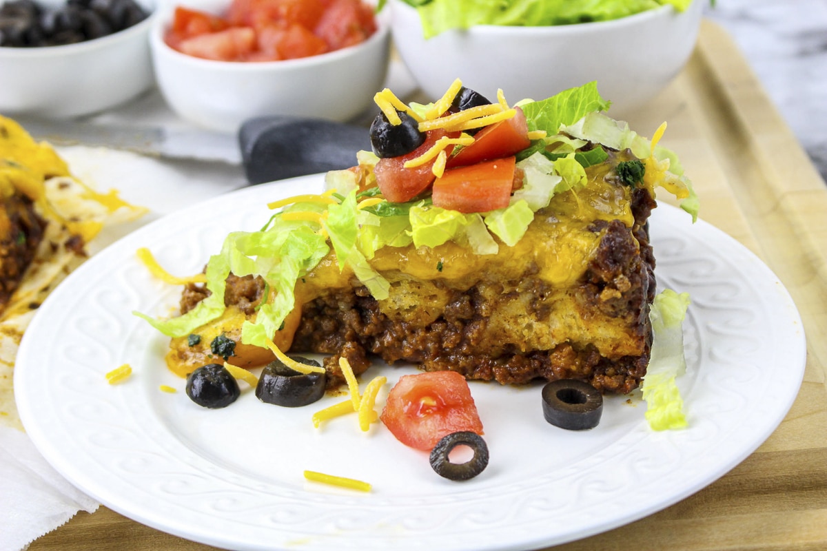 side view of casserole slice with lettuce and tomato.