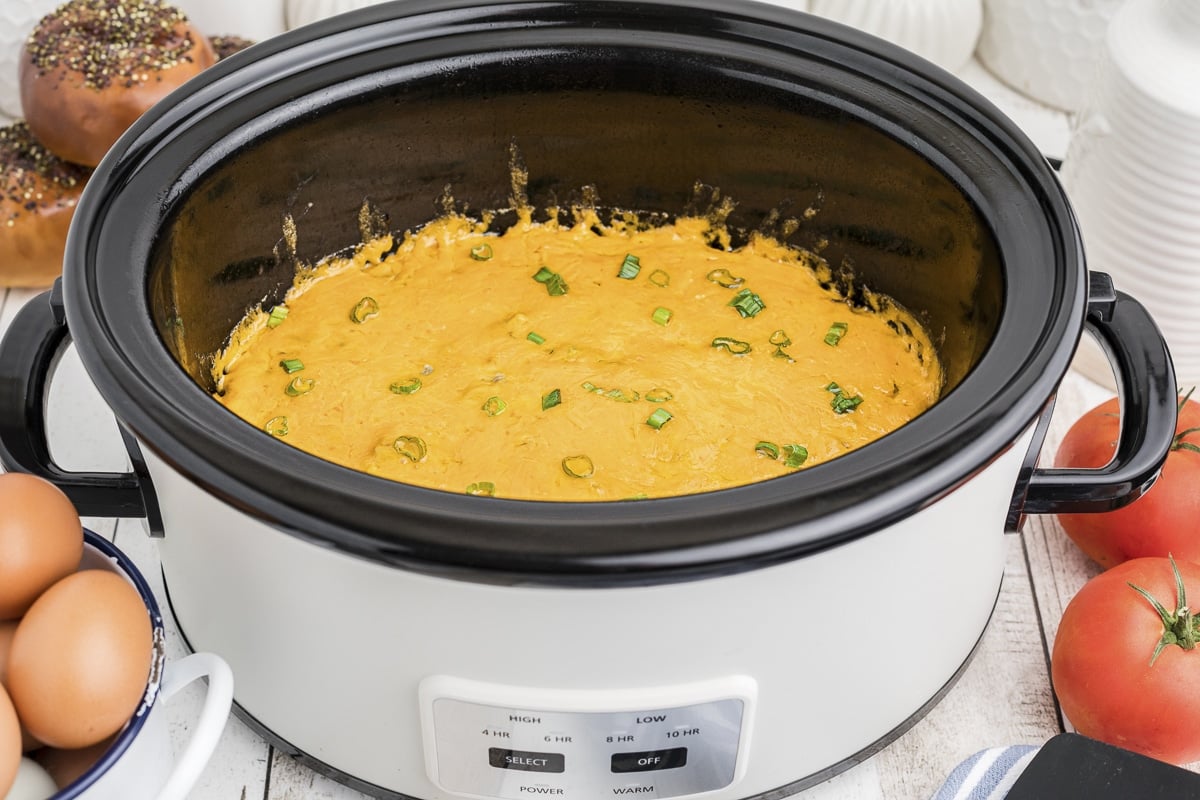 side view of sausage green chile egg casserole cooked in slow cooker.