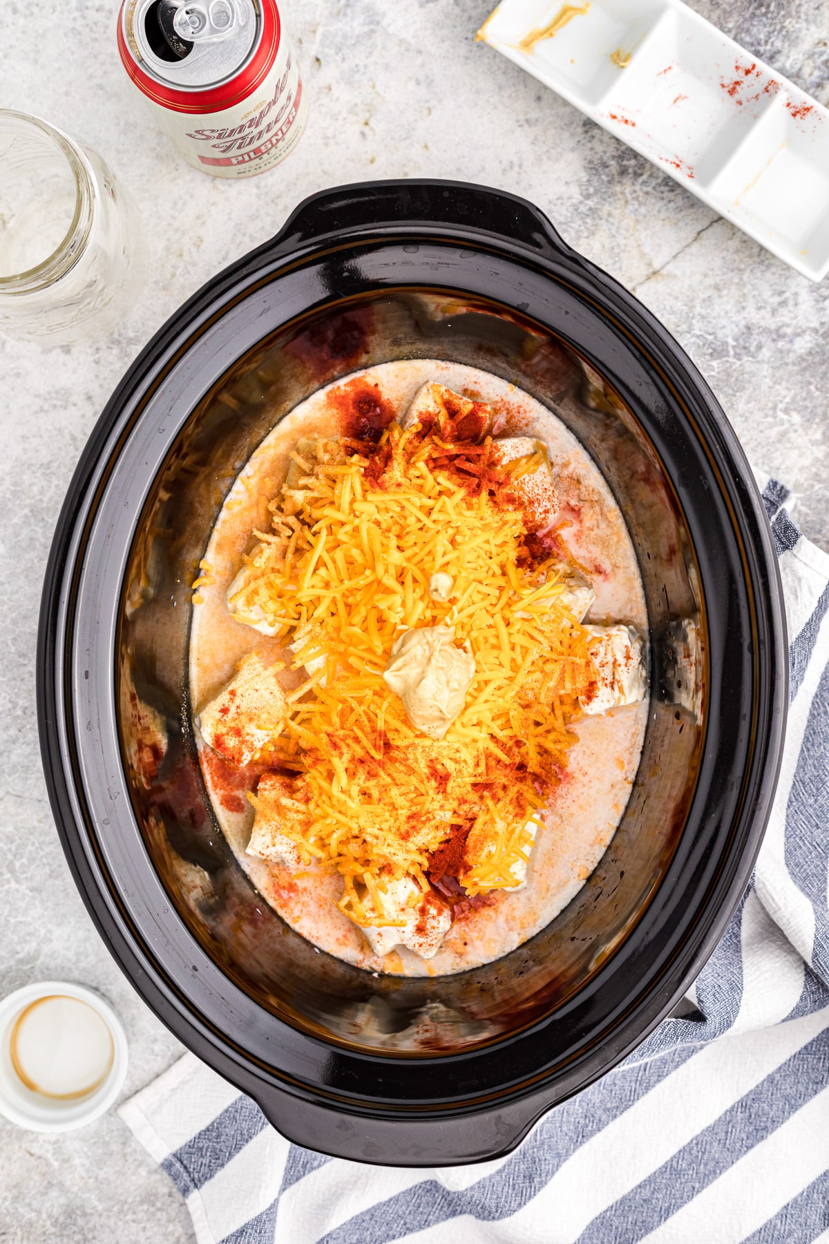 ingredients for beer cheese in a slow cooker. (