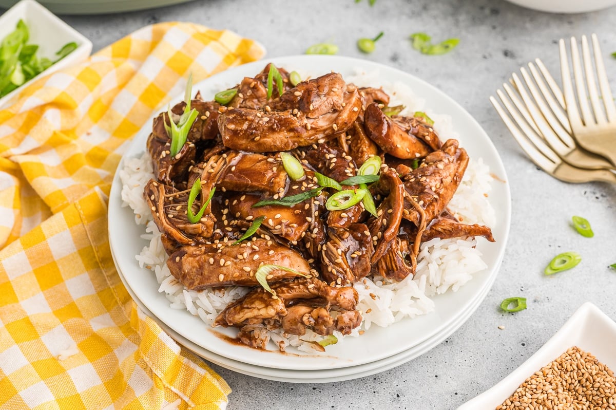 Chicken with bourbon sauce on top of white rice.