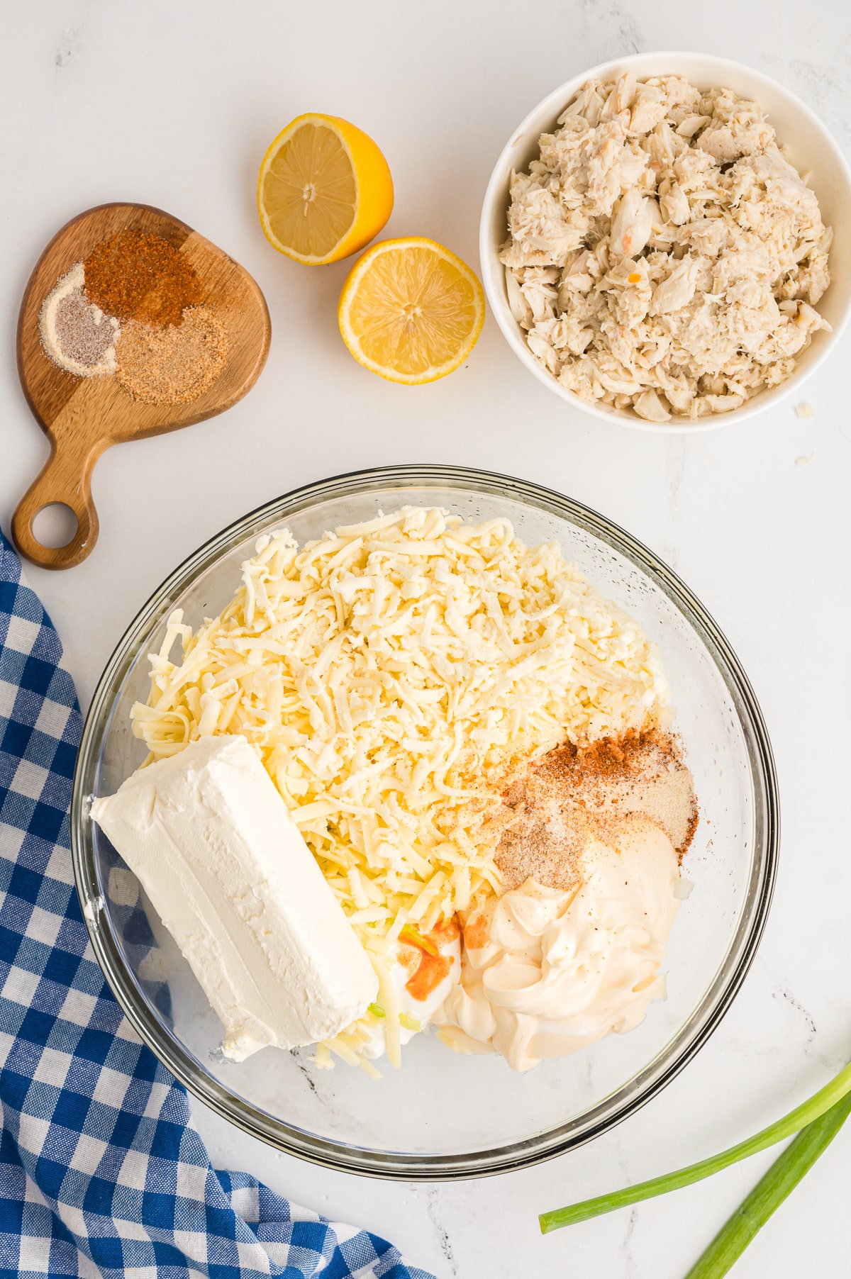 ingredients for crab dip in a bowl before being mixed. 