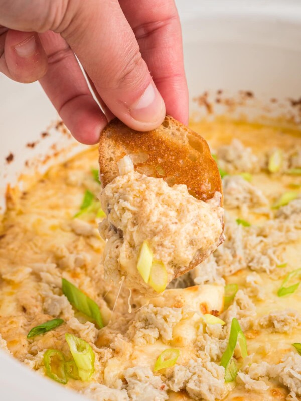crab dip on a piece of bread.