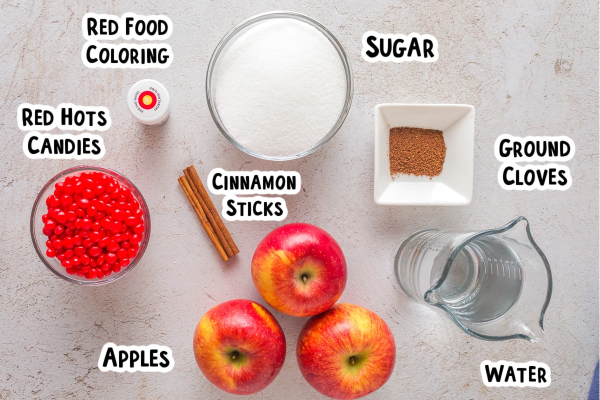 Ingredients for red hot apples on a table.