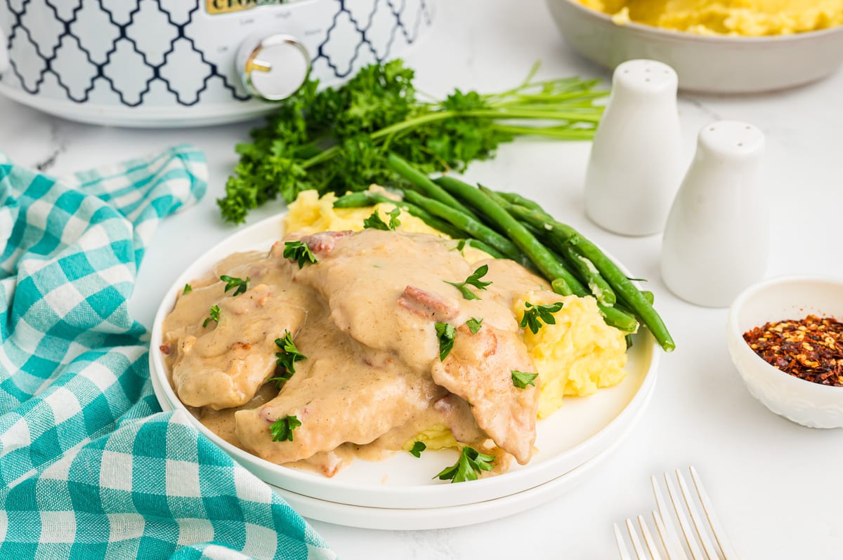 smothered chicken on a plate.