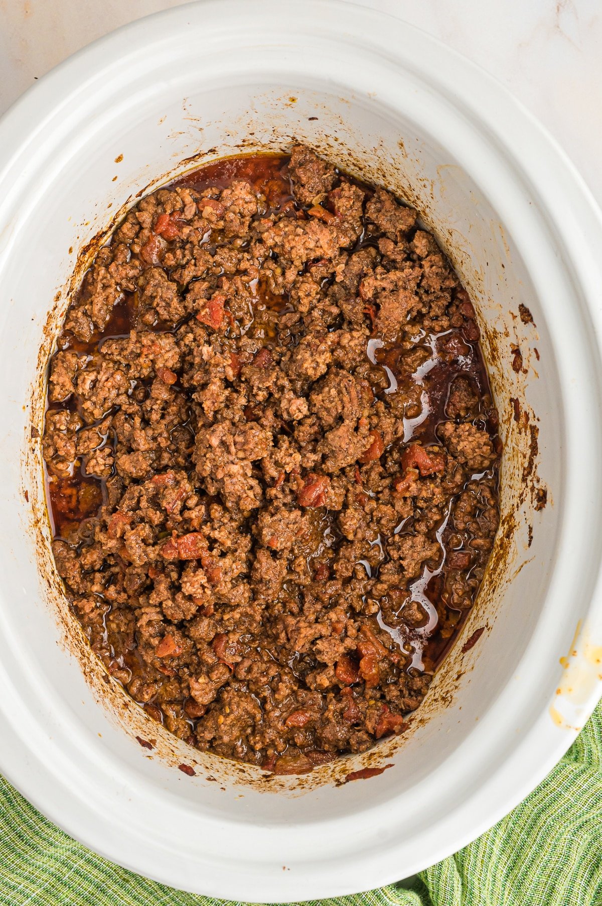 ground beef cooked in slow cooker with taco seasoning and rotel.