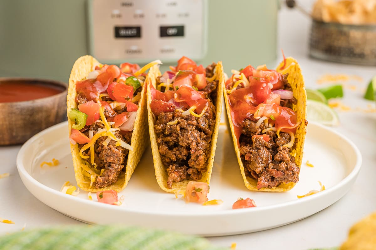 3 tacos on a plate.